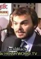 Jack Black speaking at a red carpet event, engaging with fans and media, showcasing his vibrant personality and charisma.