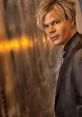 ian Culbertson in a stylish suit, showcasing his signature look and charismatic presence in a sophisticated setting.