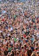 A vibrant crowd of people at an outdoor event, showcasing diversity and excitement in a lively atmosphere.