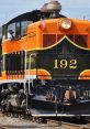 Colorful diesel train number 192 with distinctive design, showcasing classic locomotive features on vibrant tracks.