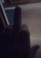A hand showing a disruptive gesture, conveying strong emotions related to frustration or defiance.