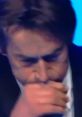 Zetpil presentation featuring a focused individual deep in thought during a significant moment on stage.