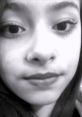 Close-up of a young girl with expressive eyes and subtle makeup, showcasing a natural, candid look. Oioioi style influence.