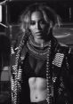 Beyoncé showcases fierce fashion and bold styling in a striking black and white portrait. Captivating and empowering.