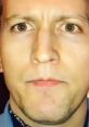 Close-up portrait of a man with intense expression, focusing on facial features and emotions.