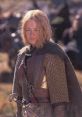 Eowyn in battle armor, showcasing her strength and determination, set against a dramatic backdrop of Middle-earth.