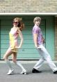 Retro dance duo showcasing 60s and 70s styles in a vibrant skit, capturing the essence of six decades of fashion and fun.