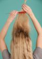 Woman combing tangled blonde hair with split ends against a turquoise background, focusing on hair care and maintenance.