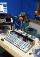 Radio studio setup with control panel, microphones, and computer, showcasing 96.5 Inner FM's broadcasting environment.