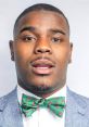 Confident young man in a blazer and festive bowtie, showcasing a stylish and cheerful look for Hahadavis.