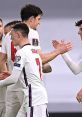 England football team celebrates a goal during a World Cup qualifier, showcasing teamwork and sportsmanship.