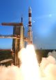 Rocket launching into the sky, generating powerful flames and smoke against a clear blue backdrop, symbolizing space exploration.