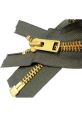 Close-up of a gold zipper on olive green fabric, showcasing durable teeth and a smooth sliding mechanism.