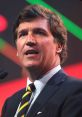 Tucker Carlson speaking passionately at a conference, showcasing his signature style and engaging the audience.