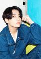Jungkook of BTS displaying a stylish look in denim, enhancing his charismatic charm against a colorful backdrop.