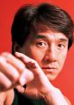 Jackie Chan showcasing his martial arts prowess against a vibrant red background, exuding intensity and focus.