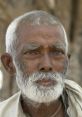 Elderly man with gray hair and a white beard, showcasing wisdom and character, reflecting a rich life experience.