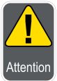 Yellow triangular warning sign with an exclamation mark and the word "Attention" on a gray background, emphasizing caution.
