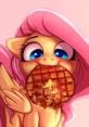 Fluttershy joyfully munching a waffle, showcasing her playful side with a sweet treat and vibrant pink backdrop.