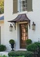 Awning As I sit on the front porch, I can hear the gentle pitter-patter of rain as it falls on the awning above me. The