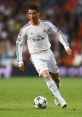 Cristiano Ronaldo dribbling the ball in a Real Madrid jersey during a UEFA Champions League match.