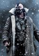 Bane stands defiantly in a snowy landscape, wearing a heavy coat and distinctive mask, embodying power and resilience.