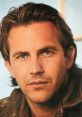 Close-up of Kevin Costner, featuring his signature hairstyle and intense gaze, showcasing his charismatic presence as an actor.