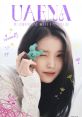 IU winks playfully while holding a cute green toy, promoting her official 6th fan club, UAENA, with colorful graphics.