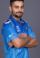 Virat Kohli in blue cricket jersey, showcasing confidence and charisma, representing India in international cricket.