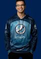 Nick Eh 30 smiles wearing a Luminosity Gaming hoodie, showcasing his energetic personality and passion for gaming.