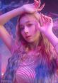Winter from Aespa poses elegantly with wavy, colorful hair, captured in a stunning, ethereal glow. Kpop star allure.