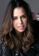 Laura Bailey exudes confidence in a stylish black leather jacket, showcasing her talent as a versatile actress.