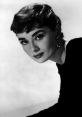 Classic portrait of Audrey Hepburn showcasing her timeless beauty and iconic style, highlighting her signature short hairstyle.