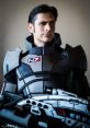 Commander Shepard in N7 armor, showcasing a fierce gaze and iconic weapon from Mass Effect 3 cosplay.