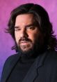 Matt Berry as George the Volcano, showcasing a serious expression against a colorful backdrop. Dramatic portrait style.