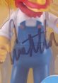 Signed Groundskeeper Willie collectible figure, featuring classic overalls, perfect for fans of The Simpsons and Dan Castellaneta.