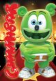 Gummibär character in a festive setting, showcasing his signature green color and playful expression on a red carpet.
