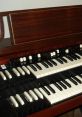 Close-up of Hammond organ keys showcasing classic black and white keys with polished wood finish, perfect for vintage music lovers.
