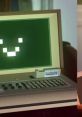 Smiling retro computer screen with keyboard, capturing nostalgia and creativity in gaming. Perfect for Minecraft fans!