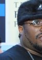 Ol' Dirty Bastard wearing a distinctive fur hat, showcasing his unique style and personality as a pioneering rapper.
