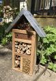 Insect hotel with natural materials, promoting biodiversity and shelter for beneficial insects in the garden.