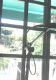 Microphone setup by a window at Refugio Mental, overlooking a serene garden, perfect for creative sessions.