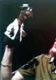 Rizzo the Rat puppet performs with Steve Whitmire, showcasing humor and creativity in a vibrant theatrical setting.
