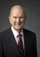 Russell M. Nelson, President of the Church of Jesus Christ of Latter-day Saints, in formal attire, smiling against a neutral background.