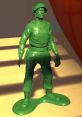 Green toy soldier figure inspired by Sarge from Toy Story, featuring classic military attire and standing on a green base.