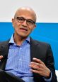 Satya Nadella discusses technology and innovation at a Microsoft event, showcasing his leadership as CEO.