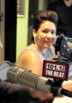Sheen Estevez smiling while speaking on air at 101.1 The Beat, showcasing her engaging personality and style.