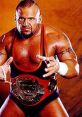 Tazz, the wrestler known as Peter Senerchia, holds a championship belt, showcasing his fierce competition spirit.