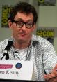 Tom Kenny speaking at a convention panel, sharing insights about his role as The French Narrator in popular media.