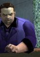 Toni Cipriani, the iconic mobster, sits at a table in a stylish purple suit, exuding power and authority.